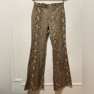 Snake print pants by Gucci